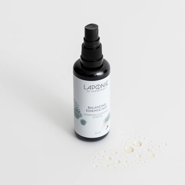Laponie Balancing Essence Mist with clear product swatch sprayed onto the surface